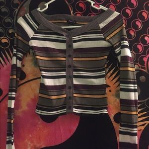 A long sleeve, off the shoulder fitted shirt